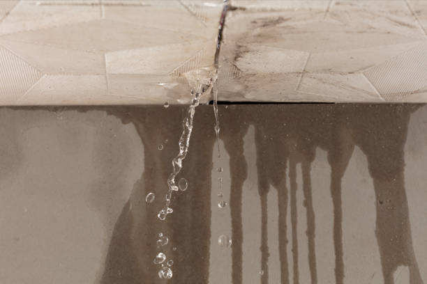 Professional Flood Damage Cleanup technician working in Bellingham, MA